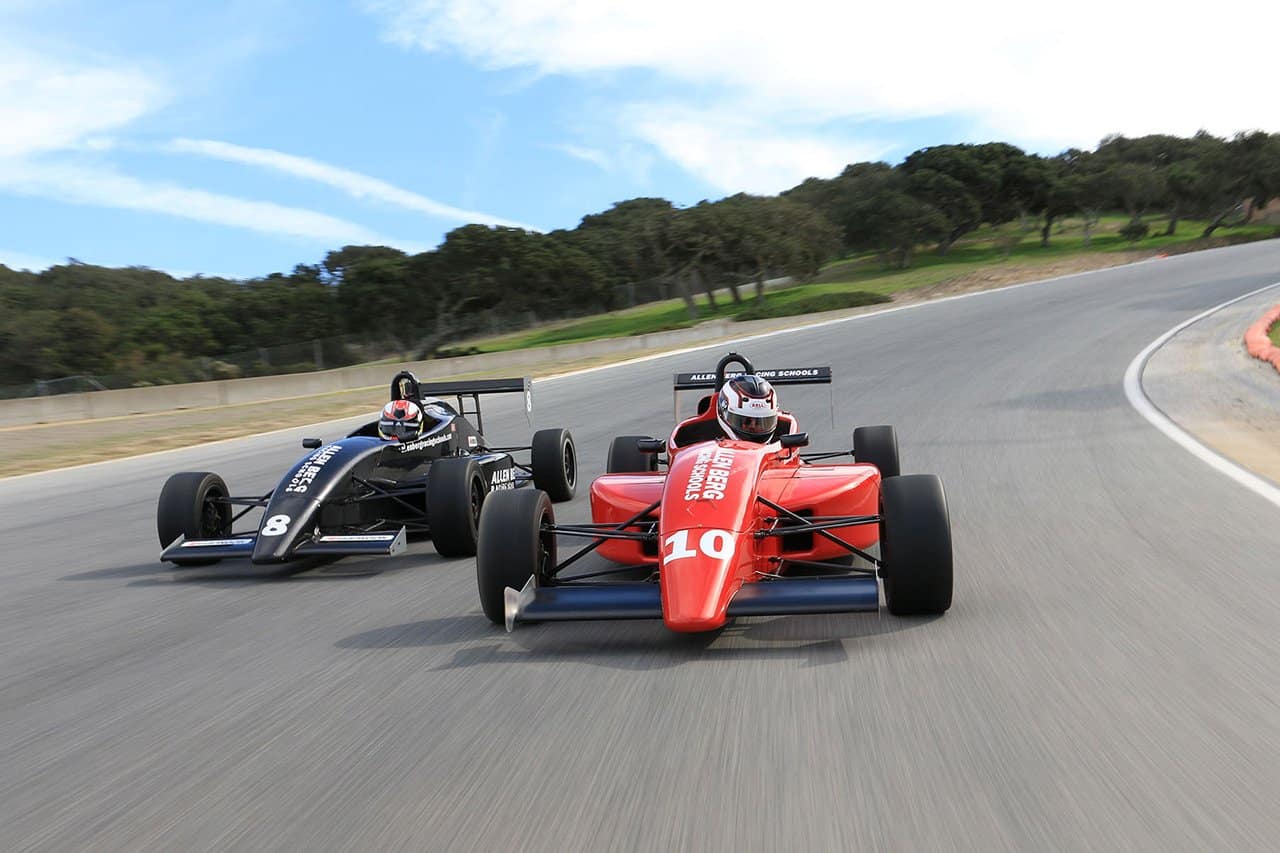 two drivers practicing on track